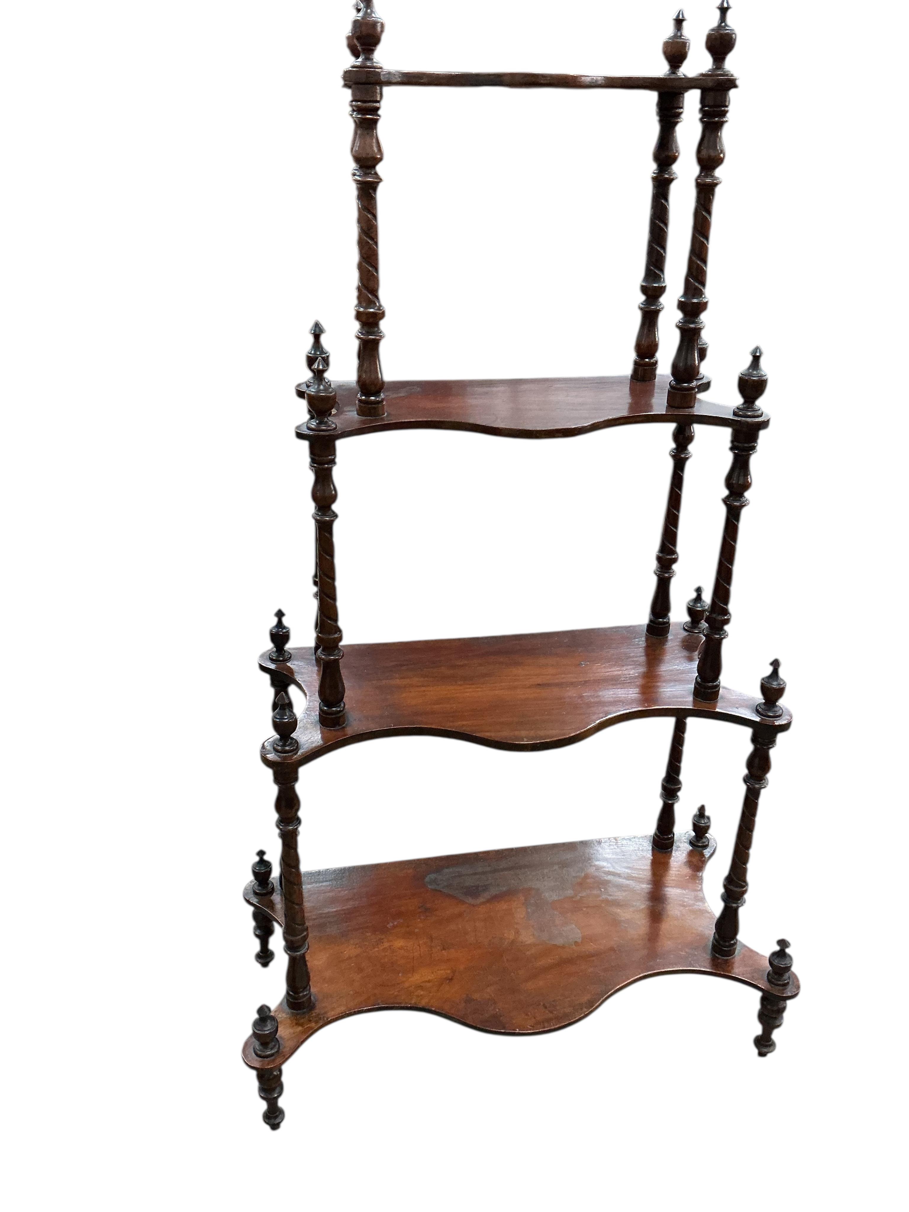 A Victorian mahogany four tier serpentine whatnot, width 65cm, depth 31cm, height 102cm